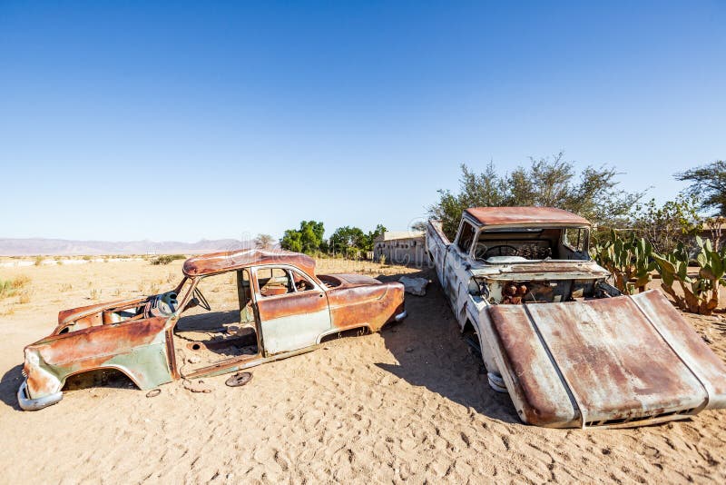 Old and rusty car wreck at the last gas station before the Namib desert. Solitaire, Namibia. Old and rusty car wreck at the last gas station before the Namib desert. Solitaire, Namibia