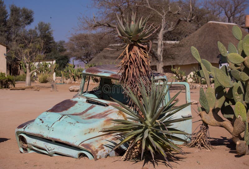 Abandoned old wrecked historic cars near a service station at Solitaire in Namibia desert ear the Namib-Naukluft National Park. Abandoned old wrecked historic cars near a service station at Solitaire in Namibia desert ear the Namib-Naukluft National Park