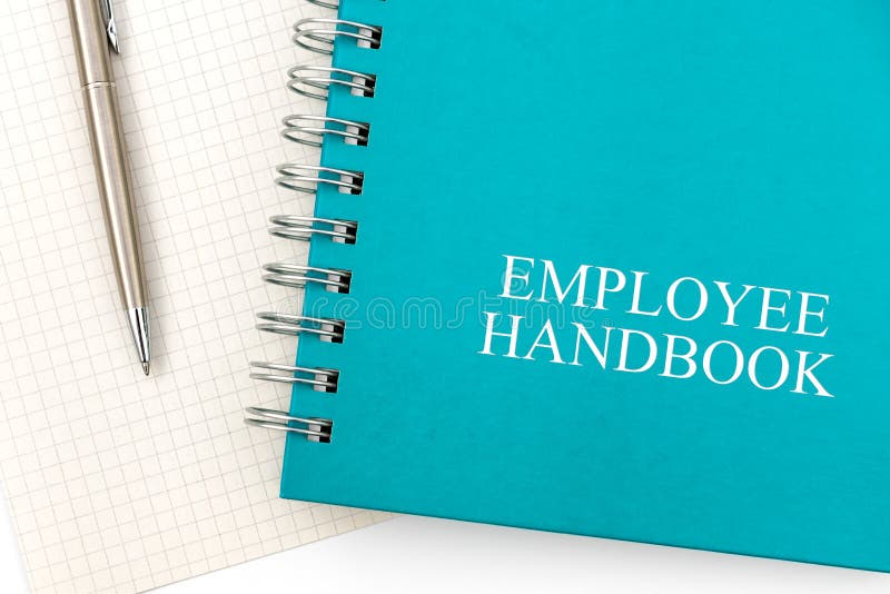 Employee Handbook or manual with a pen and paper on a white table in an office - personnel management policy, explains business goals, results, defines personnel practices. Employee Handbook or manual with a pen and paper on a white table in an office - personnel management policy, explains business goals, results, defines personnel practices
