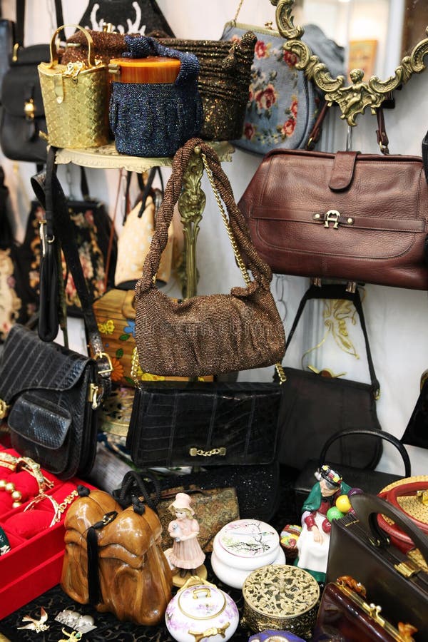 Many vintage women`s bags in the flea market. Many vintage women`s bags in the flea market