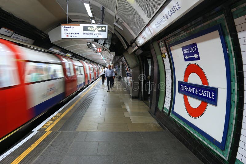 LONDON, UK - JULY 7, 2016: People wait for the underground train at Elephant & Castle station. London Underground is the 11th busiest metro system worldwide with 1.1 billion annual rides. LONDON, UK - JULY 7, 2016: People wait for the underground train at Elephant & Castle station. London Underground is the 11th busiest metro system worldwide with 1.1 billion annual rides.