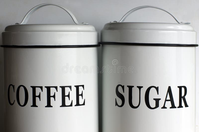 White coffee and sugar containers. White coffee and sugar containers.
