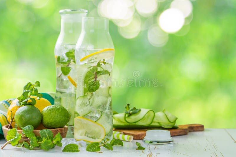 Infused lemon and cucumber water, copy space, outside. Infused lemon and cucumber water, copy space, outside