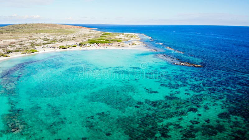 Aerial view of Baby Beach in Aruba during a hot summer day with turquoise ocean Aruba island, Antilles, Caribbean Sea. Aerial view of Baby Beach in Aruba during a hot summer day with turquoise ocean Aruba island, Antilles, Caribbean Sea