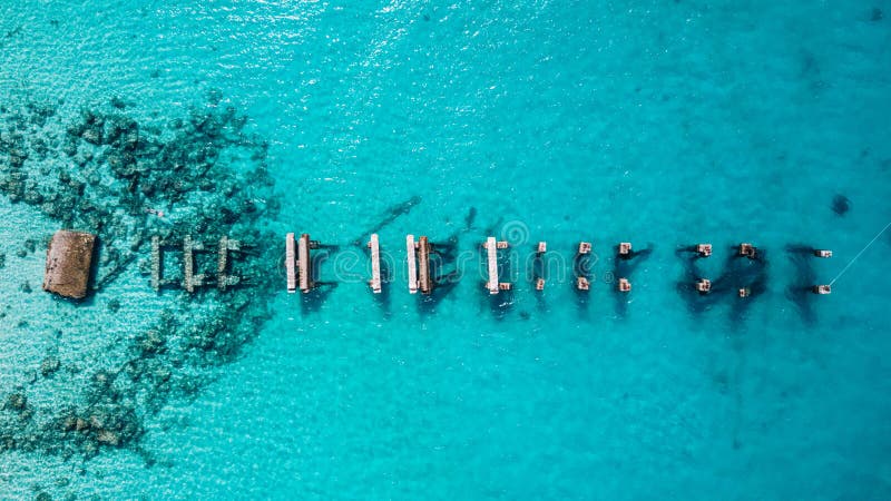 Aerial drone view of Saona Island in Punta Cana, Dominican Republic with reef, trees and beach in a tropical landscape with boats and vegetation. Aerial drone view of Saona Island in Punta Cana, Dominican Republic with reef, trees and beach in a tropical landscape with boats and vegetation