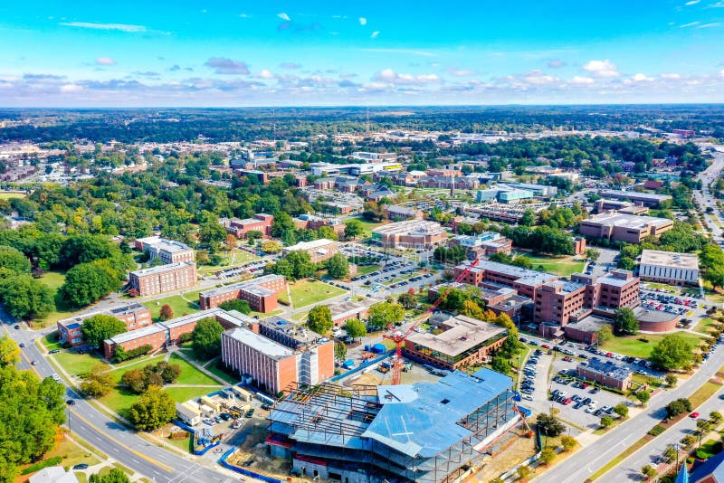 An aerial shot of North Carolina A & T with a cloudy blue sky in the background. An aerial shot of North Carolina A & T with a cloudy blue sky in the background