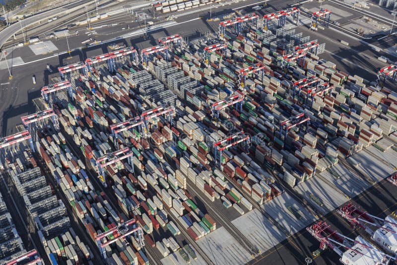 Long Beach, California, USA - July 10, 2017: Aerial view of cargo container stacks at the Port of Long Beach near Los Angeles, California. Long Beach, California, USA - July 10, 2017: Aerial view of cargo container stacks at the Port of Long Beach near Los Angeles, California.