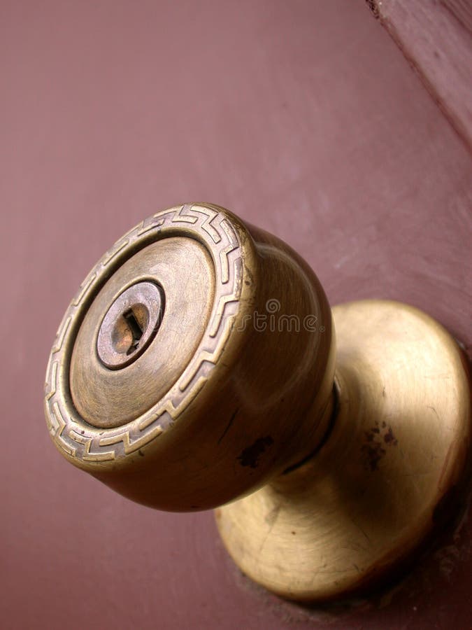 Older styled door knob of a brass nature. The image is taken from the perspective of looking up as if you are underneath the door knob. Older styled door knob of a brass nature. The image is taken from the perspective of looking up as if you are underneath the door knob.