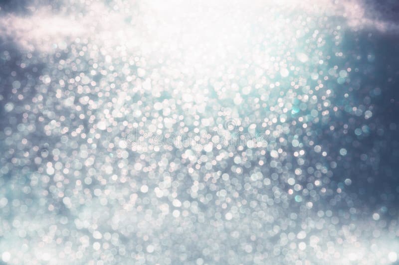 Εορταστικό μπλε ασημένιο λαμπρό bokeh glittery στοκ εικόνα Εορταστικό μπλε ασημένιο λαμπρό bokeh glittery στοκ εικόνα
