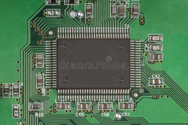 Close up photo of a digital data circuit. A big chip and connections are visible, symbolizing technology and computers. Close up photo of a digital data circuit. A big chip and connections are visible, symbolizing technology and computers.