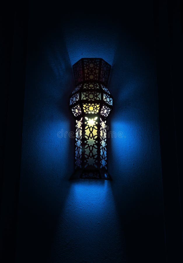 An illuminated wall mounted Arabic lamp. An illuminated wall mounted Arabic lamp