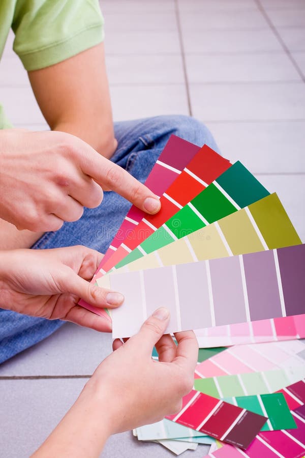 Couple choosing paint color for new home. Couple choosing paint color for new home