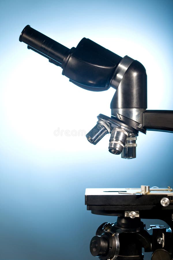 Science microscope on blue background. Science microscope on blue background