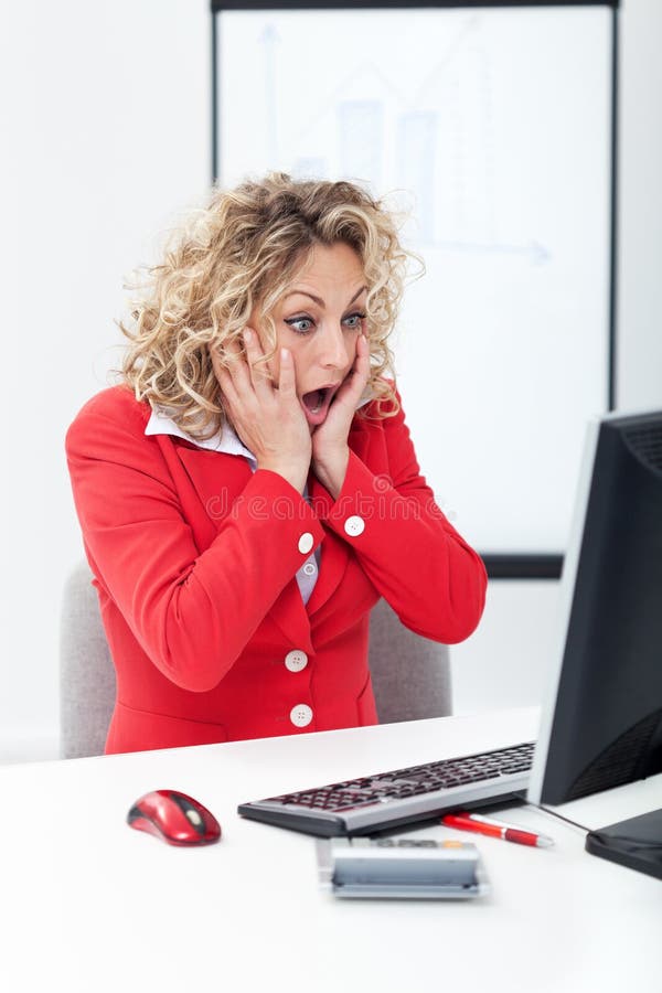 Oh no - shocked business woman in front of computer in the office. Oh no - shocked business woman in front of computer in the office