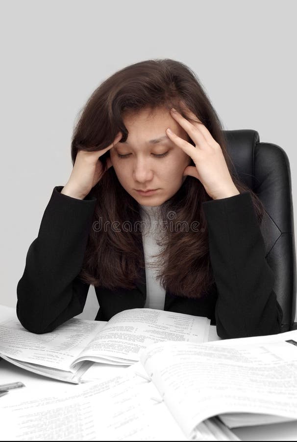 Businesswoman reading papers. Businesswoman reading papers