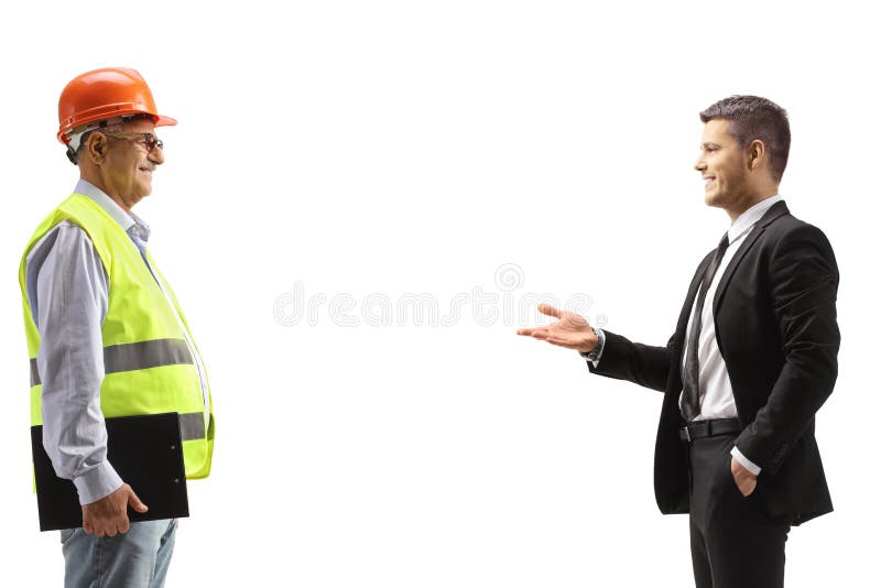επιχειρηματίας που μιλάει σε μηχανικό στοκ φωτογραφία