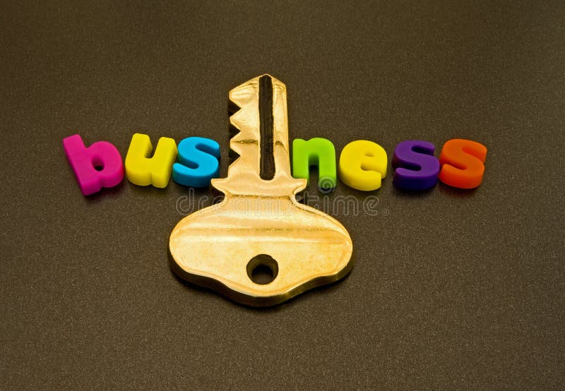 A macro image of the word business spelled out in colorful lower case letters but where the 'i' has been replaced with a gold key. A macro image of the word business spelled out in colorful lower case letters but where the 'i' has been replaced with a gold key.