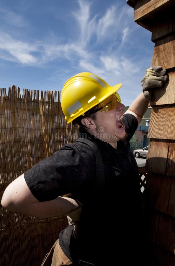 Carpenter at work over blue sky day time. Carpenter at work over blue sky day time