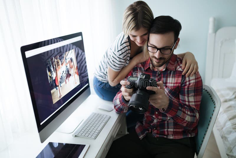 Couple in love working from home on design project. Couple in love working from home on design project