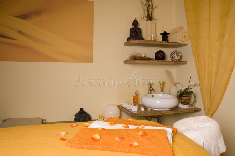 Inside a beautiful spa room with a lot of essential utensils as a wide angle horizontal image. Inside a beautiful spa room with a lot of essential utensils as a wide angle horizontal image