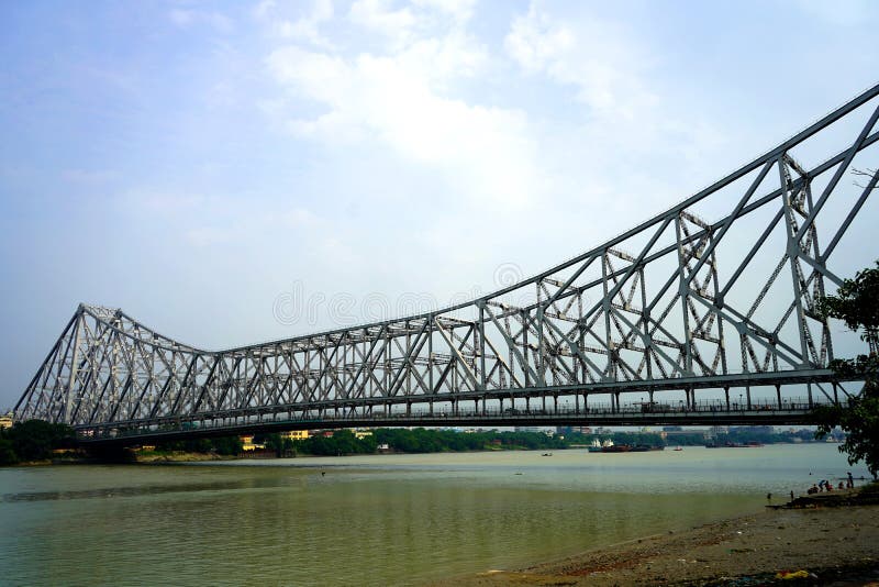 Wide Angle View of Howrah Bridge from Mullick Ghat, Howrah Bridge is connector of Kolkata and Howrah District. The Howrah Bridge is a balanced cantilever bridge over the Hooghly River in West Bengal, India. Wide Angle View of Howrah Bridge from Mullick Ghat, Howrah Bridge is connector of Kolkata and Howrah District. The Howrah Bridge is a balanced cantilever bridge over the Hooghly River in West Bengal, India.