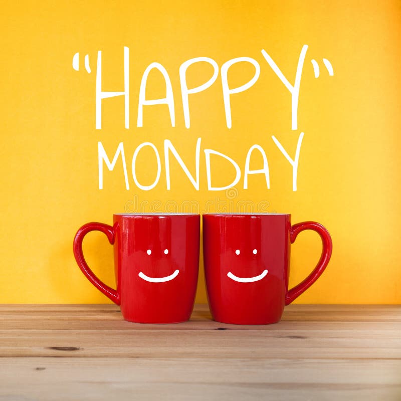 Happy Monday word.Two cups of coffee and stand together to be heart shape on yellow background with smile face on cup. Happy Monday word.Two cups of coffee and stand together to be heart shape on yellow background with smile face on cup.