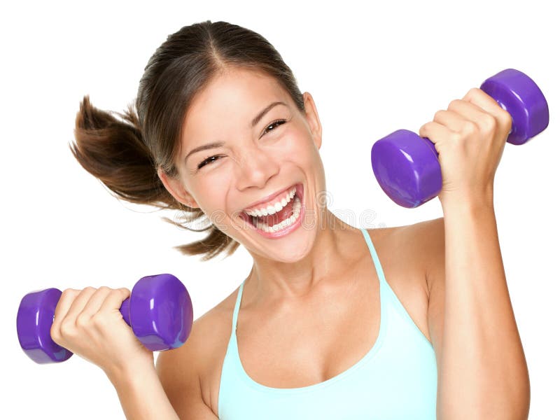 Happy fitness woman lifting dumbbells smiling cheerful, fresh and energetic. Mixed race Asian Caucasian fitness girl training isolated on white background. Happy fitness woman lifting dumbbells smiling cheerful, fresh and energetic. Mixed race Asian Caucasian fitness girl training isolated on white background.