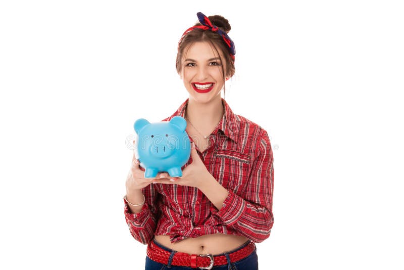Ευτυχής γυναίκα που κρατά την μπλε piggy τράπεζα με τα μέρη των χρημάτων στοκ φωτογραφία με δικαίωμα ελεύθερης χρήσης Ευτυχής γυναίκα που κρατά την μπλε piggy τράπεζα με τα μέρη των χρημάτων στοκ φωτογραφία με δικαίωμα ελεύθερης χρήσης
