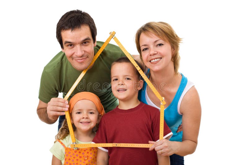 Happy family with their kids planning to buy a new home - isolated. Happy family with their kids planning to buy a new home - isolated
