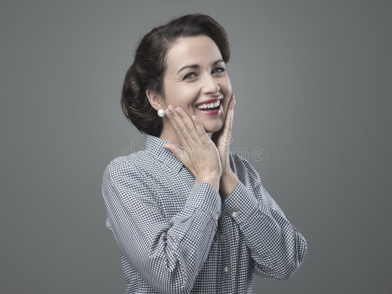 Cheerful 1950s woman feeling awesome and full of energy. Cheerful 1950s woman feeling awesome and full of energy