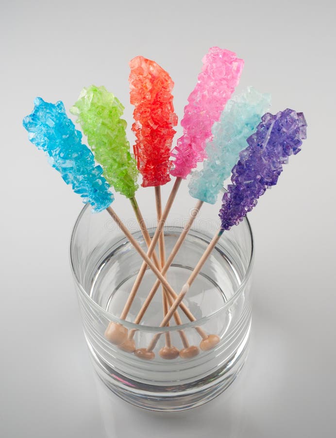 Colorful Rock sugar candy sticks in a glass. Colorful Rock sugar candy sticks in a glass