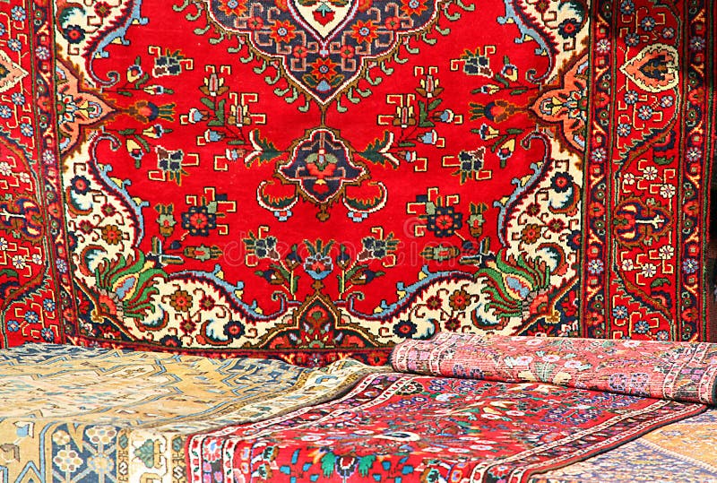 Colorful and beautiful Oriental rugs in pure Virgin wool available in a stall at the market 1. Colorful and beautiful Oriental rugs in pure Virgin wool available in a stall at the market 1