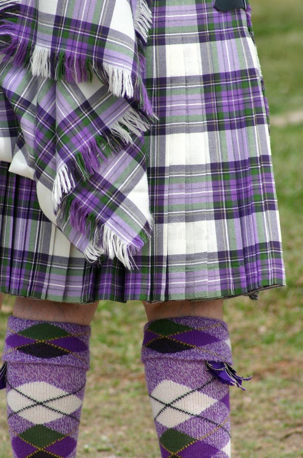 Colorful scottish tartan kilt and matching argyle socks. Colorful scottish tartan kilt and matching argyle socks