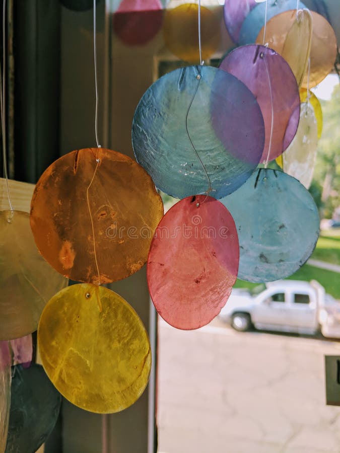 Pretty Glass Circle wind chimes by window. Pretty Glass Circle wind chimes by window