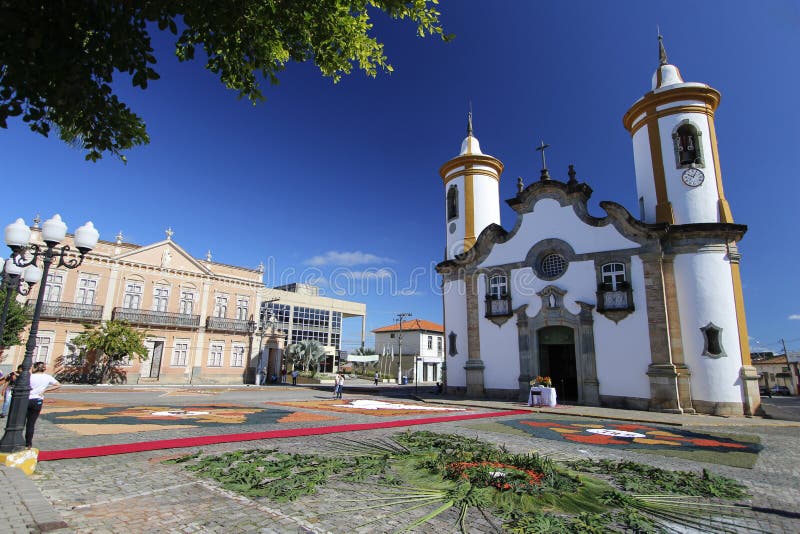 OLIVEIRA, MG / BRAZIL - 2015-06-04: Colorful carpets adorn the front of the baroque church for the celebration of Corpus Christ in Minas Gerais. OLIVEIRA, MG / BRAZIL - 2015-06-04: Colorful carpets adorn the front of the baroque church for the celebration of Corpus Christ in Minas Gerais.