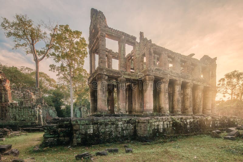 Sunrise view of popular tourist attraction ancient temple complex Angkor Wat with reflected in lake Siem Reap, Cambodia. Sunrise view of popular tourist attraction ancient temple complex Angkor Wat with reflected in lake Siem Reap, Cambodia