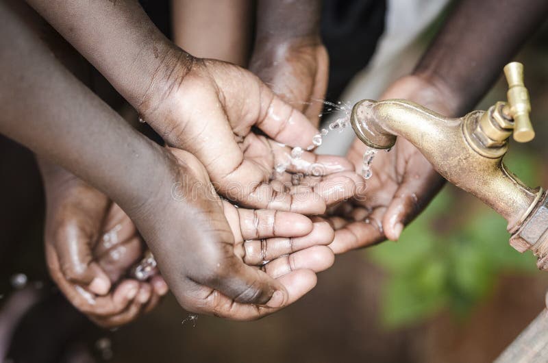 Water scarcity is still affecting one sixth of Earth`s population. Black Baby Hands Under African Water Tap World Issue. Water scarcity is still affecting one sixth of Earth`s population. Black Baby Hands Under African Water Tap World Issue