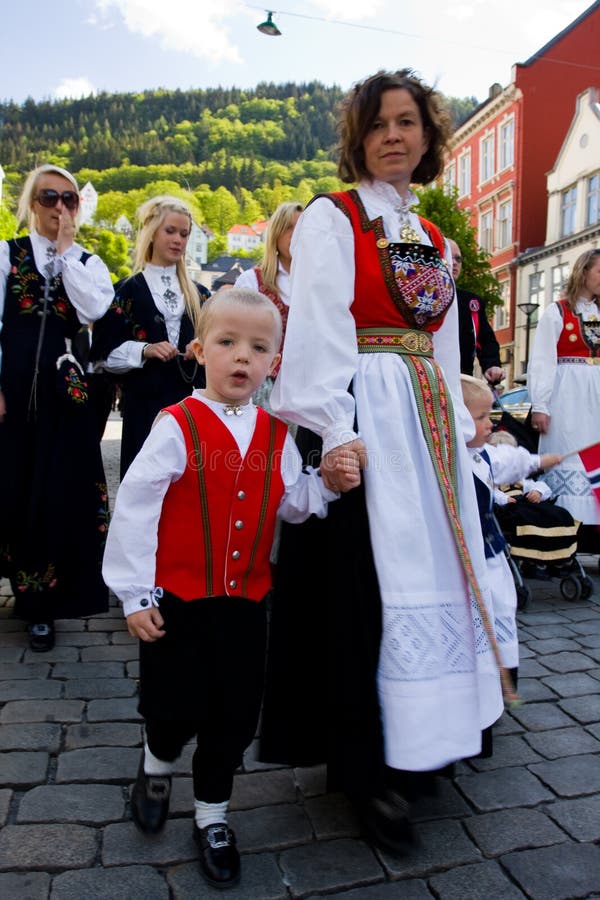 People wearing traditional folk Norwegian dresses on the streets of Bergen. 17th of May 2009 - Independence day of Norway. People wearing traditional folk Norwegian dresses on the streets of Bergen. 17th of May 2009 - Independence day of Norway.