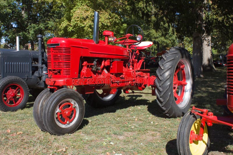 1940s Mc Cormeck Farm-All Model H tractor by International. This may be a 1941 model. Bright red, tricycle style front wheels. Medium size tractor used for plowing gardens and fields. Also used for mowing hay. 1940s Mc Cormeck Farm-All Model H tractor by International. This may be a 1941 model. Bright red, tricycle style front wheels. Medium size tractor used for plowing gardens and fields. Also used for mowing hay.