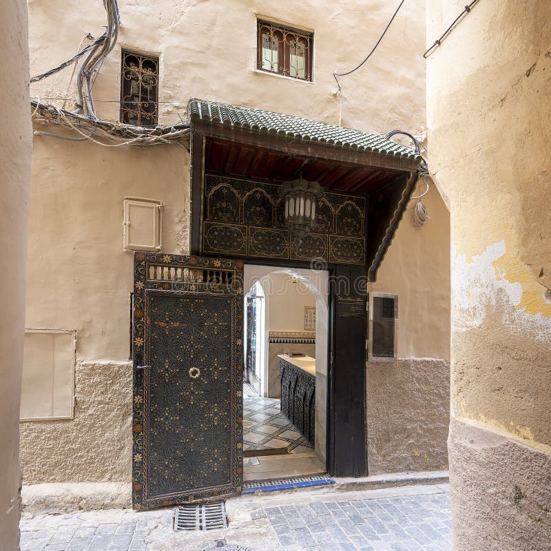 Pictured is the entrance to the Riad Maison Bleue, a luxury boutique hotel in Fes, Morocco. The Riad Maison Bleue was created in a house dating from the 19th century whose former owner, was the late Moulay Bel Arbi El Alaoui, famous judge and professor of theology. Today the luxury boutique hotel it is managed by the El Abbadi`s family. Pictured is the entrance to the Riad Maison Bleue, a luxury boutique hotel in Fes, Morocco. The Riad Maison Bleue was created in a house dating from the 19th century whose former owner, was the late Moulay Bel Arbi El Alaoui, famous judge and professor of theology. Today the luxury boutique hotel it is managed by the El Abbadi`s family.