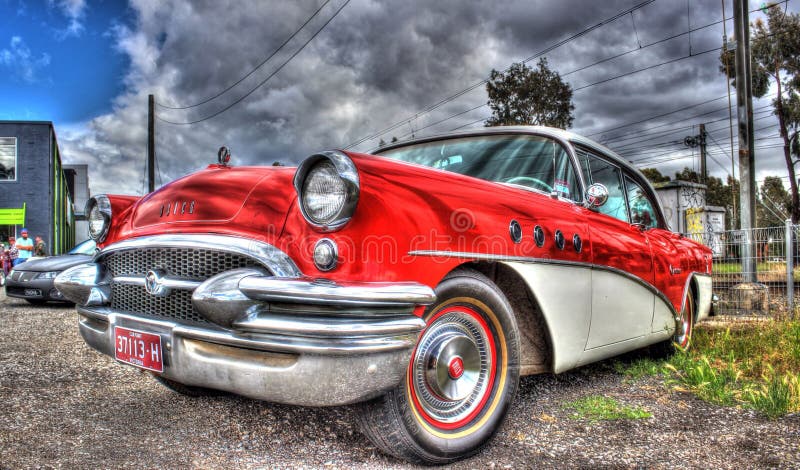 Vintage 1950s American red and white Buick on display at car show in Melbourne, Australia. Vintage 1950s American red and white Buick on display at car show in Melbourne, Australia.