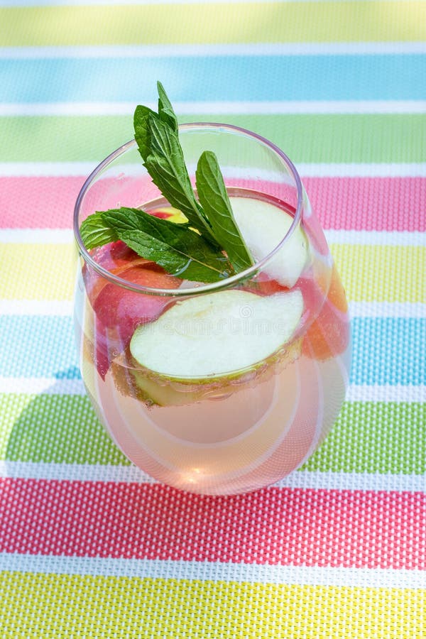 Summer refreshing infused drink beverage glass with apples and mint sparkling water. Summer refreshing infused drink beverage glass with apples and mint sparkling water