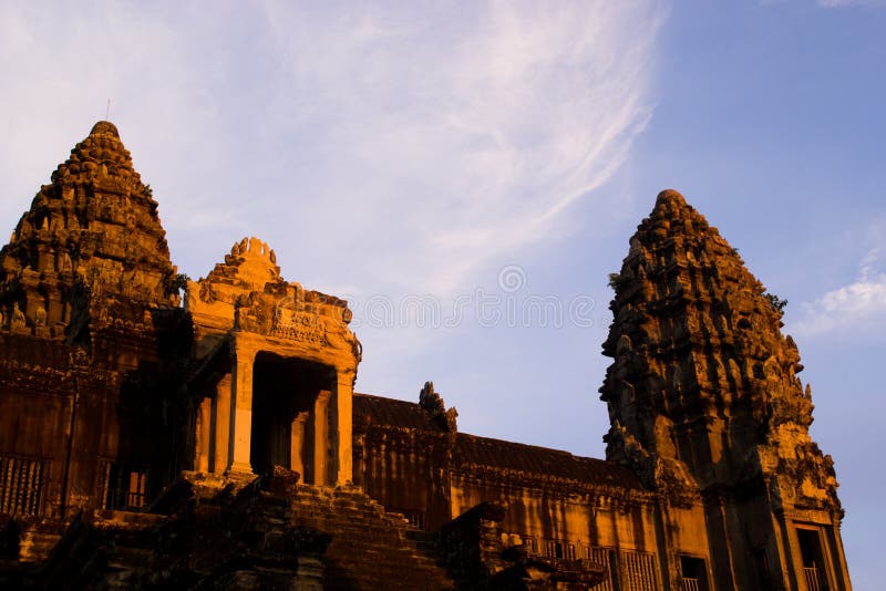 Angkor Wat at sunset, Cambodia. In front of a blue sky. Angkor Wat at sunset, Cambodia. In front of a blue sky.