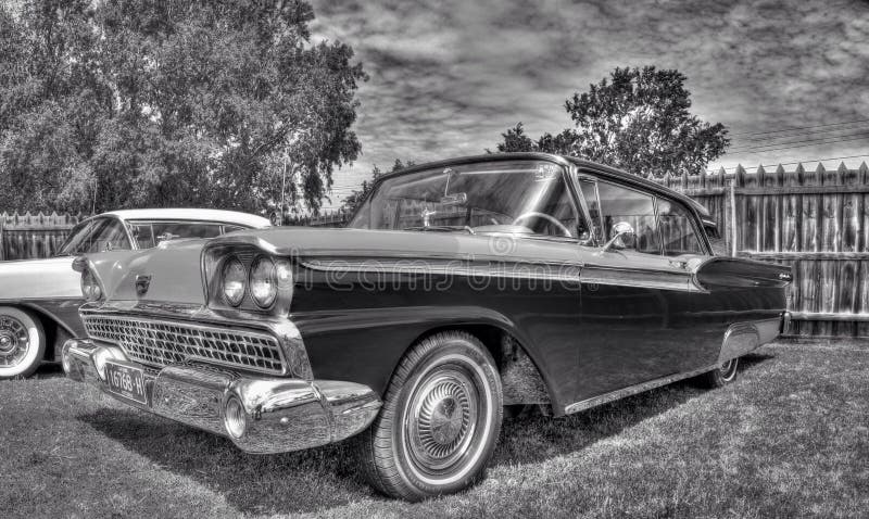 Classic American 1950s Ford Galaxie in black and white retro style photograph on display at car and bike show in Melbourne, Australia. Classic American 1950s Ford Galaxie in black and white retro style photograph on display at car and bike show in Melbourne, Australia