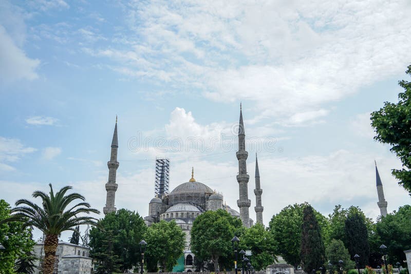 The blue mosque architectural landscape view showing heritage building restoration on blue sky background, Istanbul, Turkey. The blue mosque architectural landscape view showing heritage building restoration on blue sky background, Istanbul, Turkey