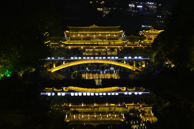 Located on the north side of Leigong Hill, Xijiang Qianhu Miao Village is about 35 km 22 miles away from Kaili city; the capital of Qiandongnan, and about 260 km 162 miles from Guiyang City; the capital city of Guizhou Province. Being the largest gathering place of the Miao in China and even the world, about ten natural Miao ethnic villages exist in Xijiang Town and the Miao culture is best preserved in this area. According to the latest statistics, there are about 1,288 families with a total population of around 6,000 people living there. 99.5% of the local people are Miao nationality. Fengyu bridge Wind-rain bridge plays an important role there. It is built by Miao people in the purpose of improving living conditions and protecting local environment. There are five Fengyu bridges made of the mixed construction of cement and wood. These bridges can connect the banks of the river and withstand flood. Located on the north side of Leigong Hill, Xijiang Qianhu Miao Village is about 35 km 22 miles away from Kaili city; the capital of Qiandongnan, and about 260 km 162 miles from Guiyang City; the capital city of Guizhou Province. Being the largest gathering place of the Miao in China and even the world, about ten natural Miao ethnic villages exist in Xijiang Town and the Miao culture is best preserved in this area. According to the latest statistics, there are about 1,288 families with a total population of around 6,000 people living there. 99.5% of the local people are Miao nationality. Fengyu bridge Wind-rain bridge plays an important role there. It is built by Miao people in the purpose of improving living conditions and protecting local environment. There are five Fengyu bridges made of the mixed construction of cement and wood. These bridges can connect the banks of the river and withstand flood.