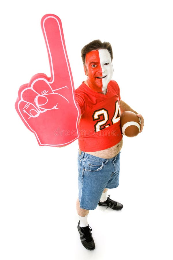 Overweight, middle aged sports fan in a football jersey with a number one foam finger. Overweight, middle aged sports fan in a football jersey with a number one foam finger.