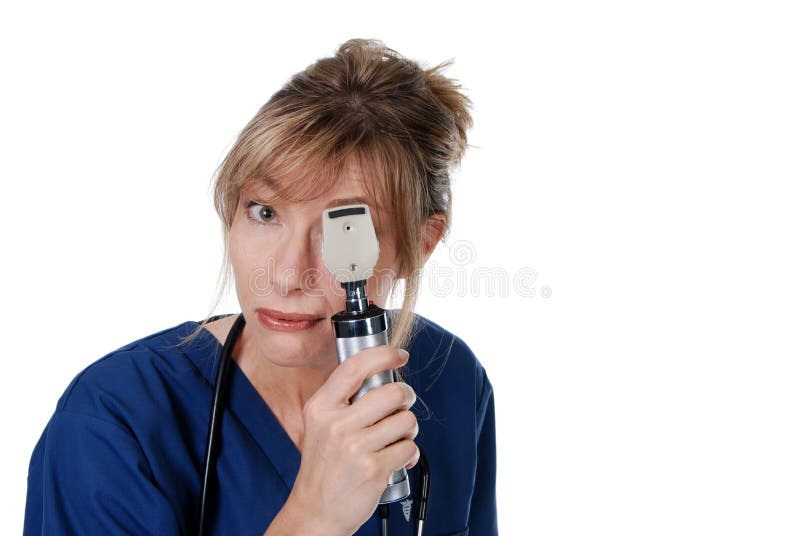 Isolated Middle aged doctor doing an eye exam on a white background. Isolated Middle aged doctor doing an eye exam on a white background