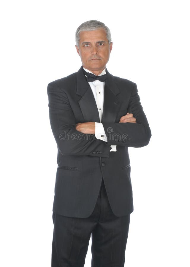 Middle aged Man Wearing Tuxedo with stern expression on his face and arms crossed isolated on white. Middle aged Man Wearing Tuxedo with stern expression on his face and arms crossed isolated on white