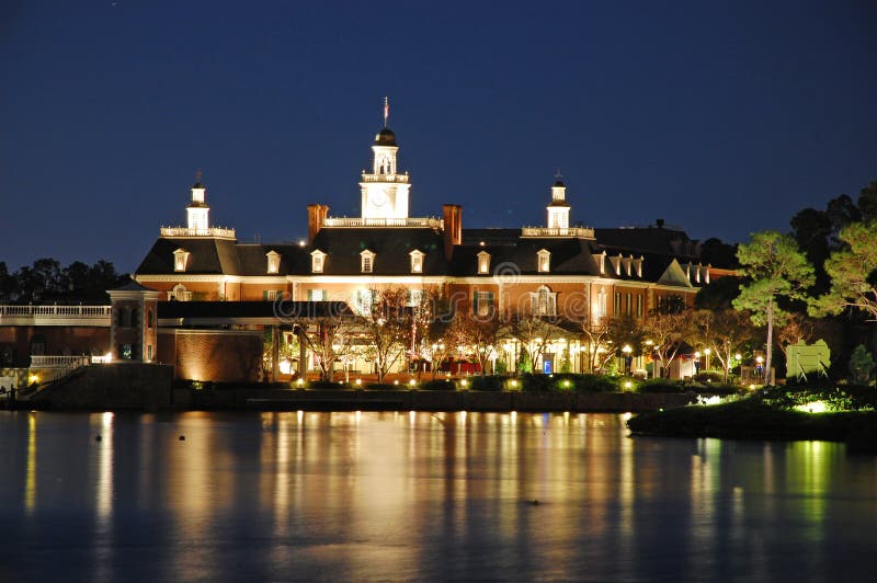 The attraction United States of America lit up at night in Epcot, Disneyworld, Florida. World Showcase is a large area reminiscent of a permanent world&#x27;s fair containing 11 pavilions, each themed and dedicated to represent a specific country. The pavilions surround the World Showcase Lagoon, a large manmade lake located in the center of World Showcase with a perimeter of 1.2 miles &#x28;1.9 km&#x29;. Each pavilion contains themed architecture, landscapes, streetscapes, attractions, shops and restaurants representing the respective country&#x27;s culture and cuisine. In an effort to maintain the authenticity of the represented countries, the pavilions are primarily staffed by citizens of the respective countries. Some pavilions also contain themed rides, shows, and live entertainment representative of the respective country. The only pavilion that is directly sponsored by the government of its respective country is Morocco; the remaining pavilions are primarily sponsored by private companies with affiliations to the represented countries. The attraction United States of America lit up at night in Epcot, Disneyworld, Florida. World Showcase is a large area reminiscent of a permanent world&#x27;s fair containing 11 pavilions, each themed and dedicated to represent a specific country. The pavilions surround the World Showcase Lagoon, a large manmade lake located in the center of World Showcase with a perimeter of 1.2 miles &#x28;1.9 km&#x29;. Each pavilion contains themed architecture, landscapes, streetscapes, attractions, shops and restaurants representing the respective country&#x27;s culture and cuisine. In an effort to maintain the authenticity of the represented countries, the pavilions are primarily staffed by citizens of the respective countries. Some pavilions also contain themed rides, shows, and live entertainment representative of the respective country. The only pavilion that is directly sponsored by the government of its respective country is Morocco; the remaining pavilions are primarily sponsored by private companies with affiliations to the represented countries.